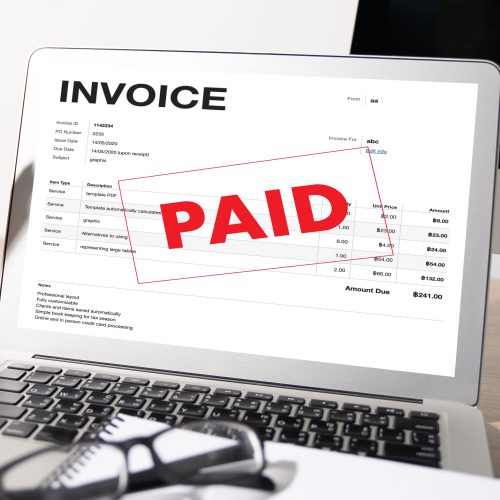 Businessman work Using The Computer Calculating  Invoice In Office Invoice Form and Accountant Checking Invoice